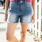 Dark Denim Mid rise raw frayed hem denim shorts