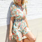 Get Whimsical Tropical Print Smocked Waist Neck Button Romper
