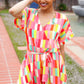 Eyes On You Coral Geo Abstract Surplice Woven Romper