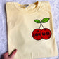 He Can Do A Lot Cherry Graphic Tee - RTS
