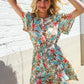 Get Whimsical Tropical Print Smocked Waist Neck Button Romper